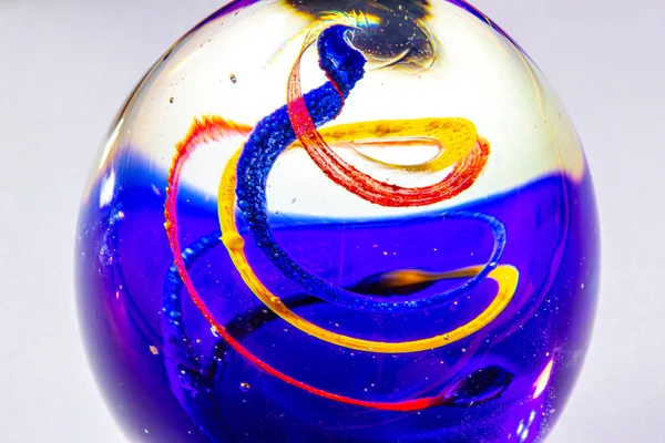 Closeup Egg Shaped Glass Ball Swirls Red Yellow Blue Colors — Stock Photo, Image