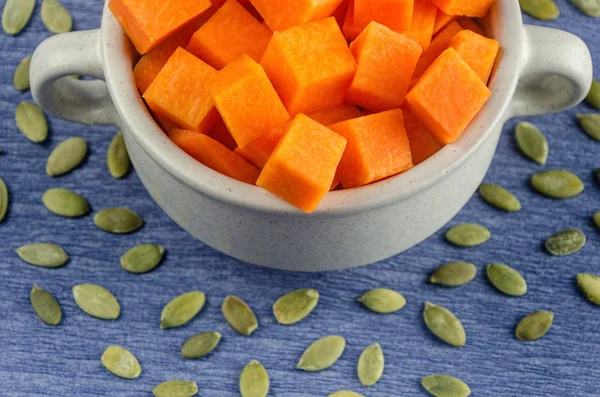 Fresh and juicy slices of pumpkin in a pot — Stock Photo, Image