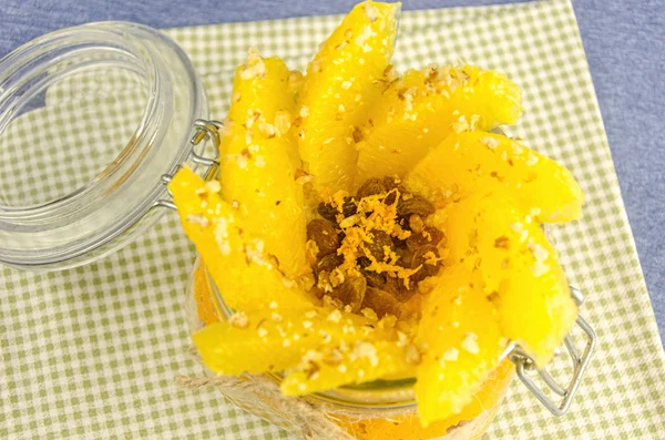 Fillet orange with porridge in pot, layer of juice — Stock Photo, Image