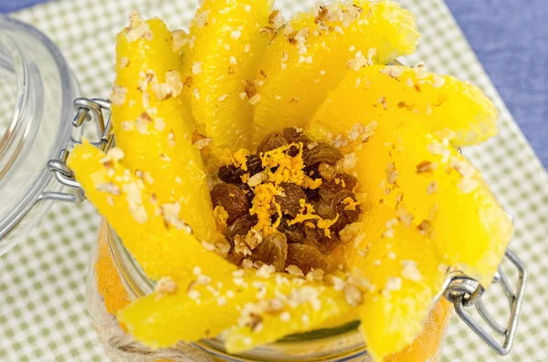 Fillet orange with porridge in pot, layer of juice — Stock Photo, Image