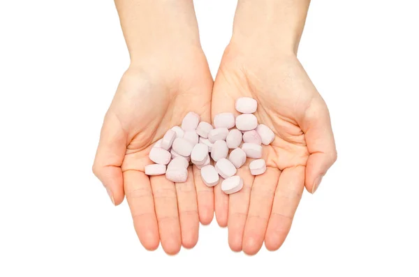 Hand eines jungen Mädchens mit Tabletten. — Stockfoto