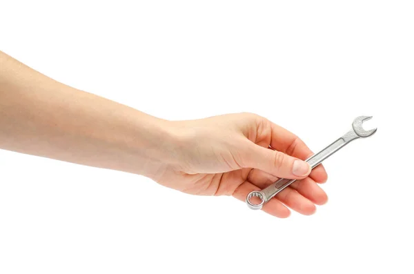 Hand eines jungen Mädchens mit Schraubenschlüssel. — Stockfoto