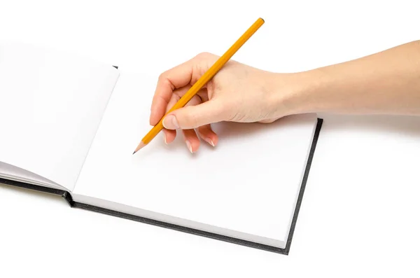 Hand of young girl holding notepad. — Stock Photo, Image