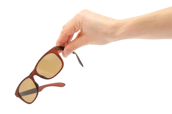 Female hand takes or gives sunglasses. — Stock Photo, Image