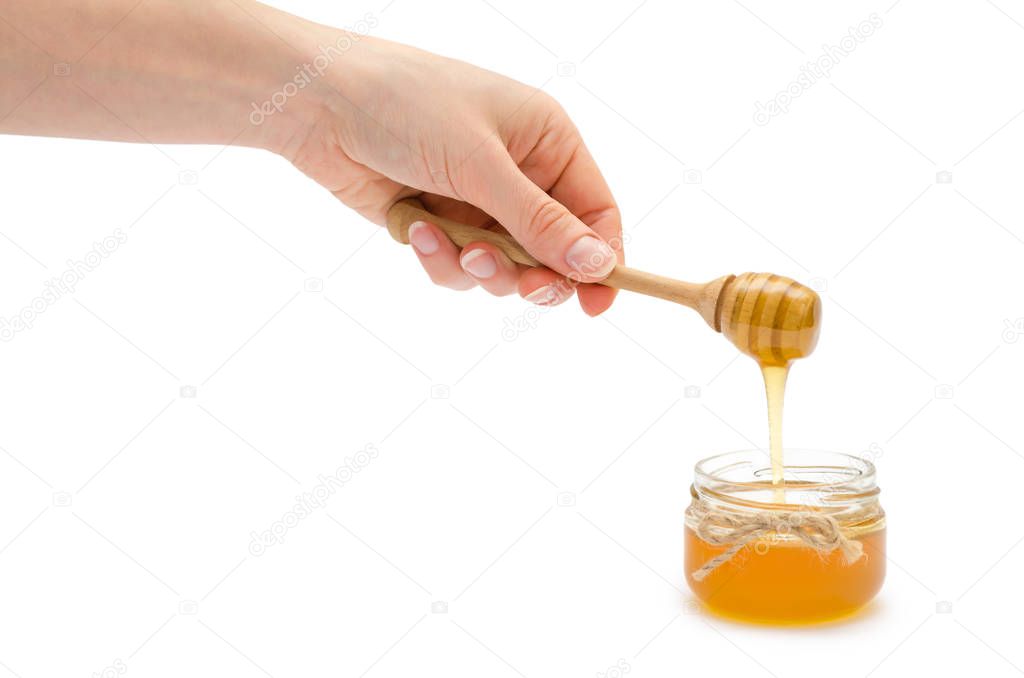 woman hand holding honey spoon.