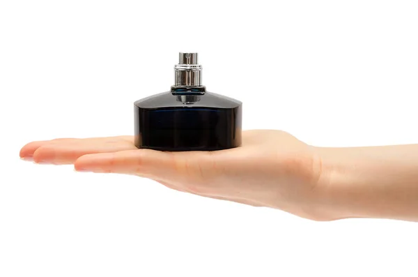 Mulher mão segurando frasco de perfume. — Fotografia de Stock