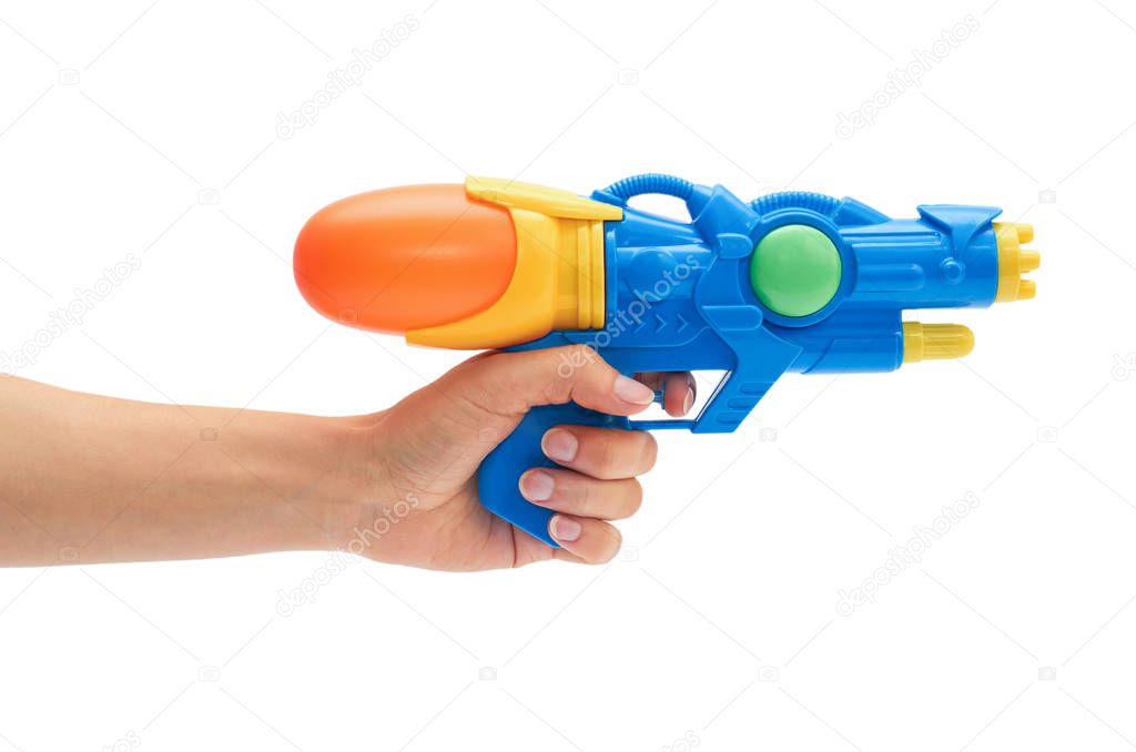 Female hand holds blue squirt gun. Isolated on white background