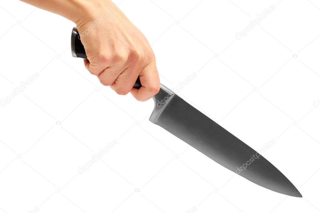 female hand holding a huge sharp knife