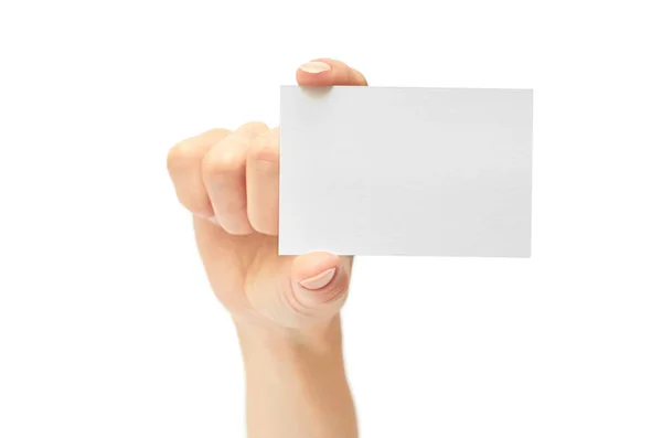 Las manos femeninas tienen una tarjeta de visita. Aislado sobre fondo blanco — Foto de Stock