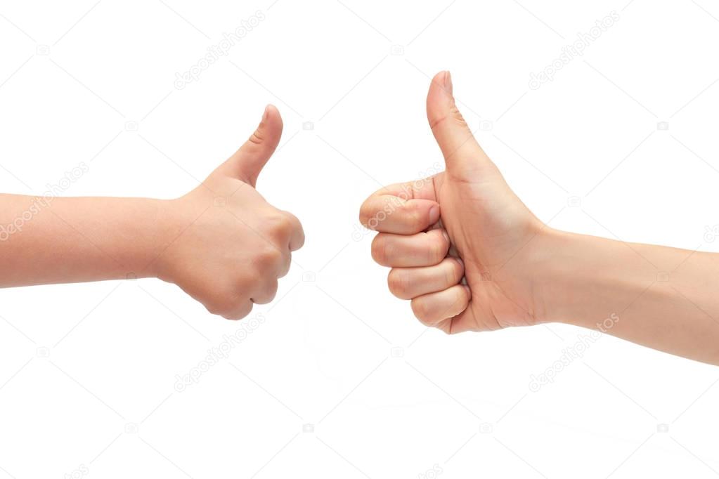 hand of young girl and kids hand gesture, shows thumbs up. Isolated on white background