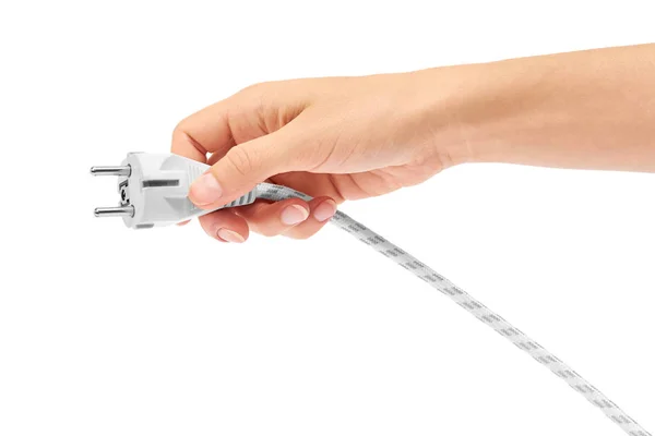 Жіноча рука тримає електричний кабель з вилкою ізольовано на білому тлі — стокове фото