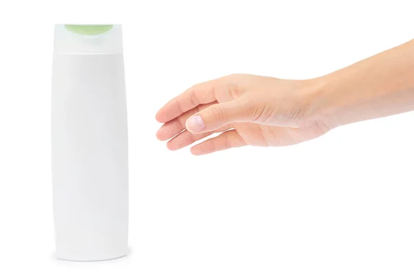 Hand hält Shampoo-Flasche isoliert auf weißem Hintergrund — Stockfoto