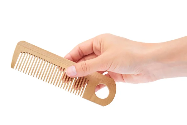 Hand holding hair brush isolated on white background — Stock Photo, Image