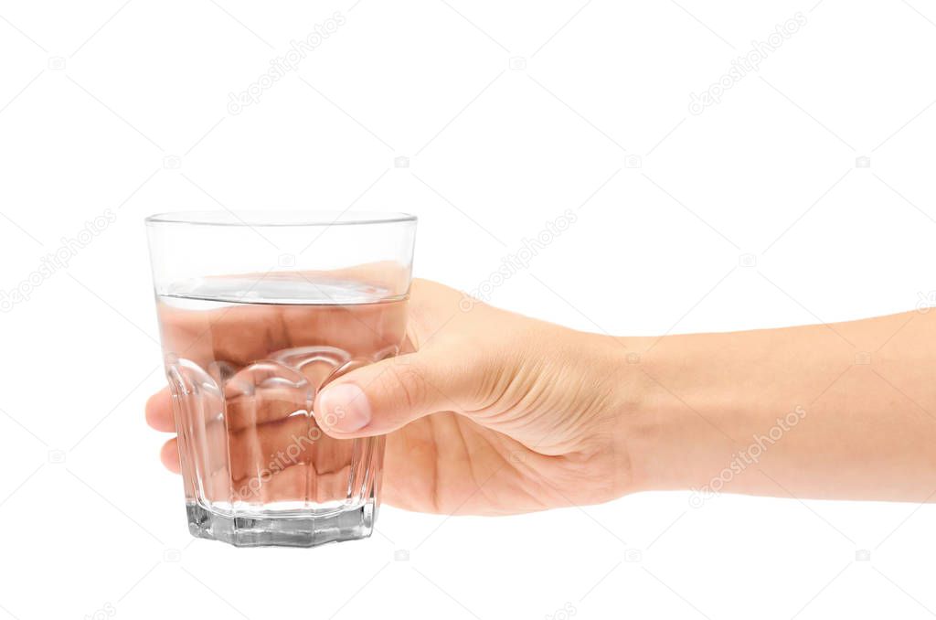 female hand holding glass cup. Isolated on white background