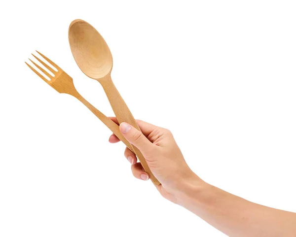 Trä gaffel och sked i hand isolerad på vit bakgrund — Stockfoto