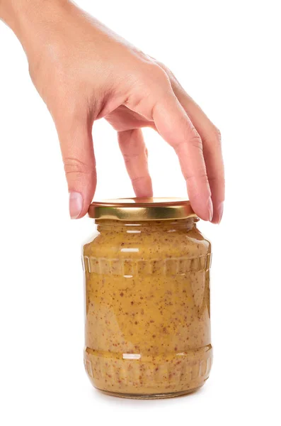 Rumah membuat mustard dalam botol kaca di tangan Terisolasi di latar belakang putih — Stok Foto