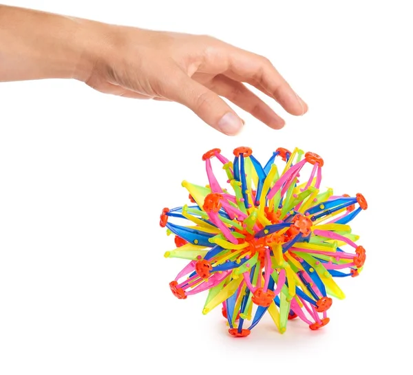 Bola transformador colorido na mão isolado no fundo branco — Fotografia de Stock