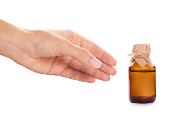 Bottle with tincture in hand isolated on white background — Stock Photo, Image