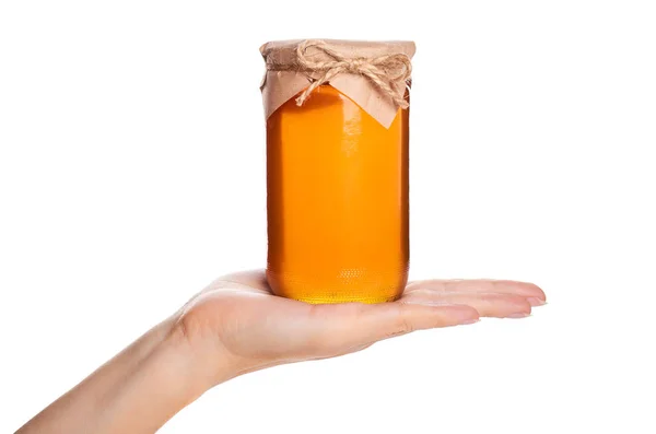 Eco home made honing in pot in de hand geïsoleerd op witte achtergrond — Stockfoto