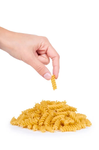 Pasta spiral in hand isolated on white background — Stock Photo, Image