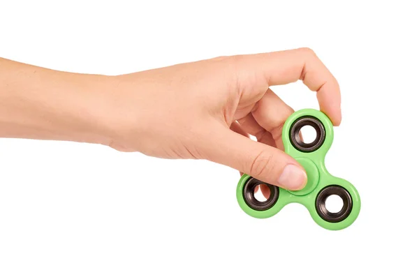 Fidget spinner verde na mão isolado no fundo branco — Fotografia de Stock