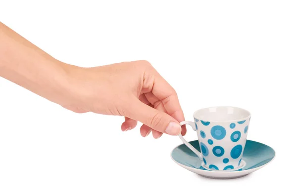 Чашка цвета и блюдце в руке изолированы на белом фоне — стоковое фото