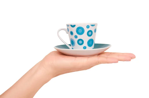 Tasse und Untertasse in der Hand isoliert auf weißem Hintergrund — Stockfoto