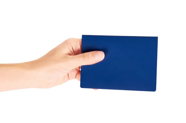 Elinde beyaz arka plan üzerinde izole mavi uluslararası pasaportu — Stok fotoğraf