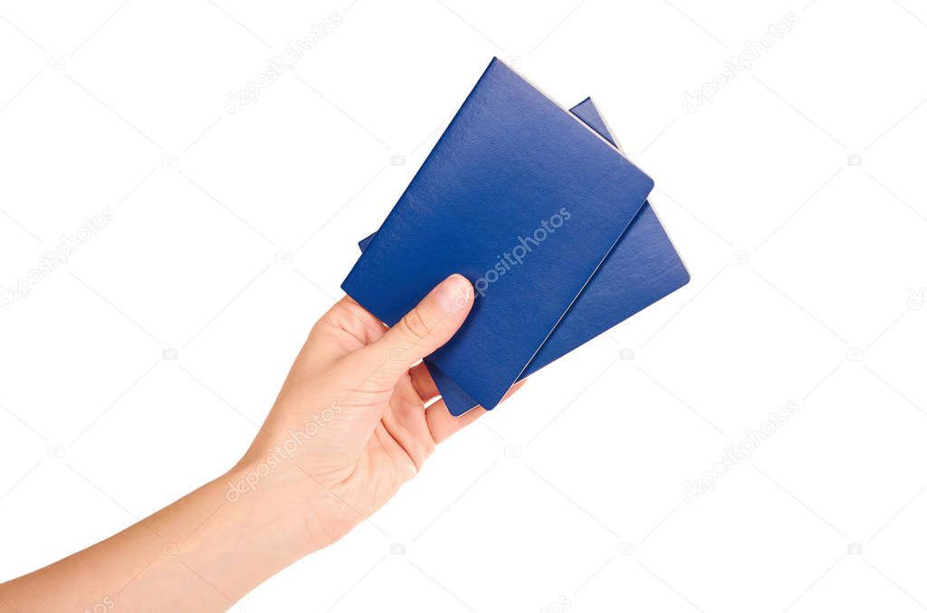 blue international passport in hand isolated on white background