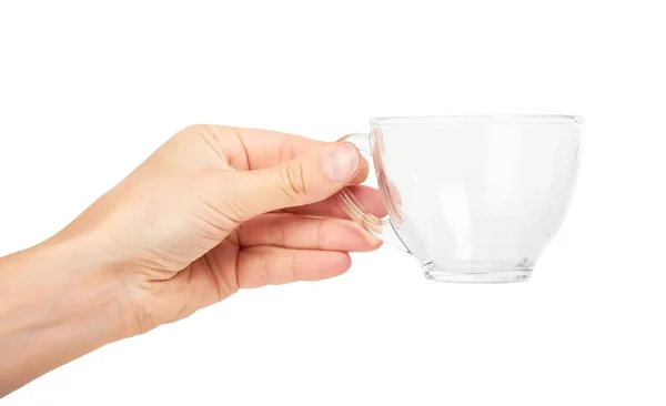 Main femelle tenant tasse en verre transparent. Isolé sur fond blanc — Photo