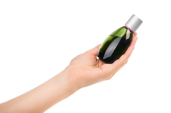 Vrouwelijke hand met parfumfles. Geïsoleerd op witte achtergrond — Stockfoto