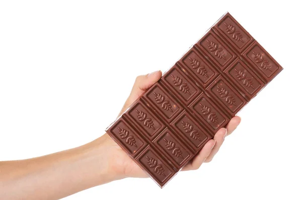 Шоколадная плитка с орехами в руке изолированы на белом фоне — стоковое фото