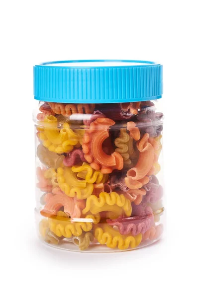 Dry Italian pasta in plastic bottle isolated on white background — Stock Photo, Image