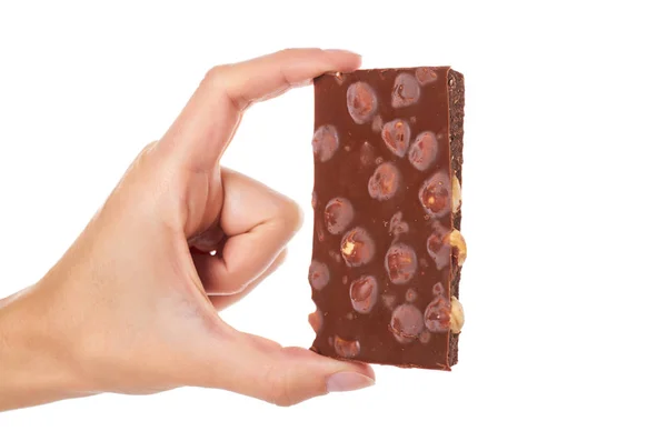 Chokladkaka med nötter i hand isolerad på vit bakgrund — Stockfoto