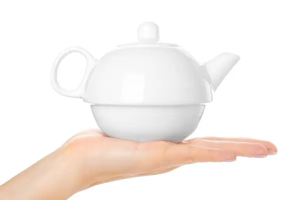 White ceramic tea pot in hand isolated on white background — Stock Photo, Image