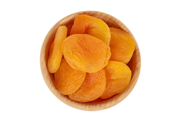 ahşap kase beyaz arka plan üzerinde sağlıklı tatlı snack izole lezzetli ve sağlıklı Kuru Kayısı