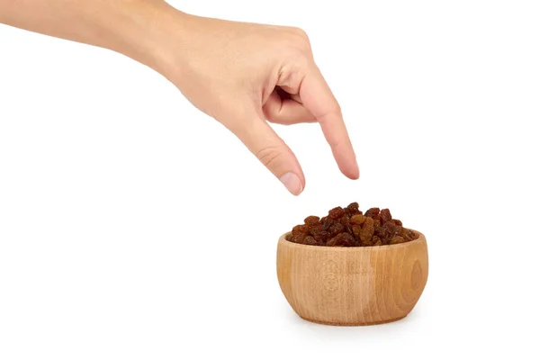 Délicieux et sains raisins secs dans un bol en bois isolé sur fond blanc, collation sucrée saine — Photo