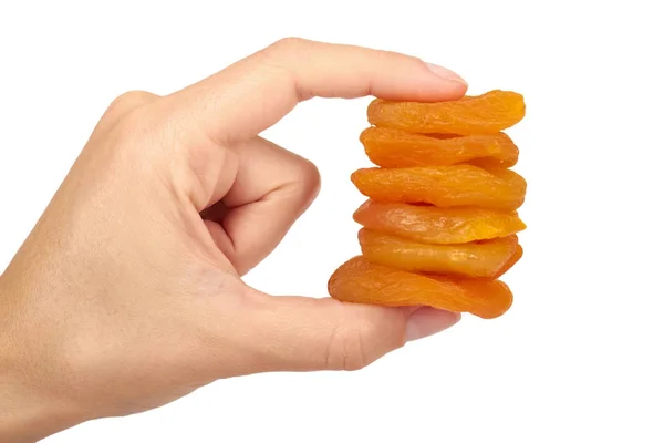 Leckere und gesunde getrocknete Aprikosen in der Hand isoliert auf weißem Hintergrund, gesunde süße Zwischenmahlzeit — Stockfoto
