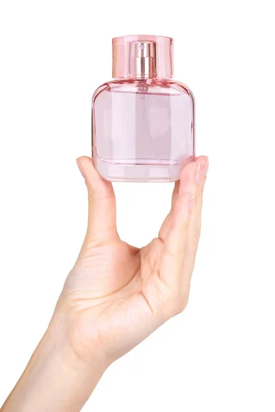 Perfume de mujer en hermosa botella de color rosa aislado sobre fondo blanco, olor de lujo, vidrio cristalino —  Fotos de Stock