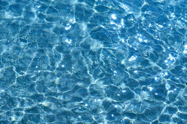 Shining blue water ripple background. Vacation idea — Stock Photo, Image