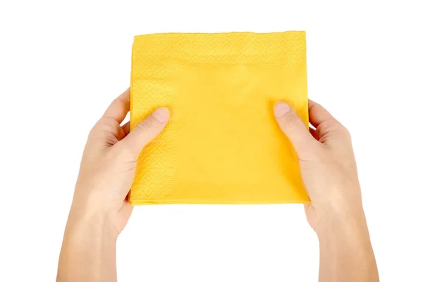 Guardanapo de papel amarelo para alimentos na mão isolado em fundo branco. Cozinha servindo objeto . — Fotografia de Stock