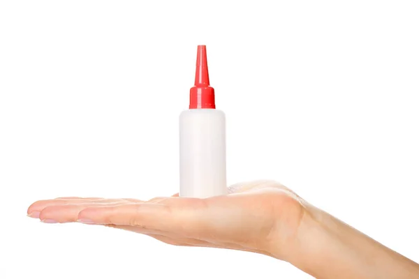 White glue container in hand isolated on a white background — Stock Photo, Image