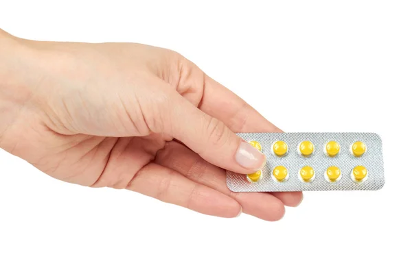 Medicina pílulas em blister, comprimidos de drogas na mão, isolado em fundo branco. Farmácia e medicação — Fotografia de Stock