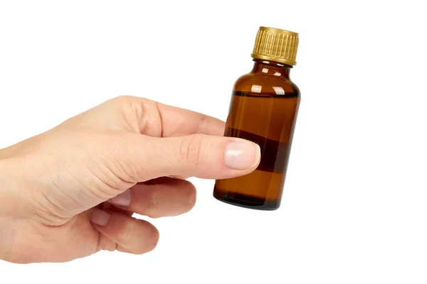 Frasco con elixir médico, jarabe para resfriados, suspensión antipirética en la mano. Aislado sobre fondo blanco. Salud y medicina — Foto de Stock