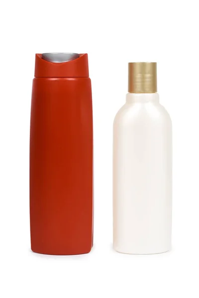 Récipients en plastique rouge et blanc. Isolé sur fond blanc. Modèle de bouteille et d'emballage. Espace de copie vierge — Photo