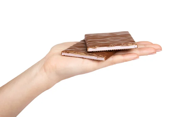 Prato de chocolate com preenchimento na mão. Isolado sobre um fundo branco. Comida doce e saborosa — Fotografia de Stock