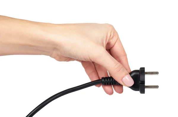 Enchufe de alimentación negro, conector eléctrico con cable en la mano. Aislado en backgorund blanco — Foto de Stock