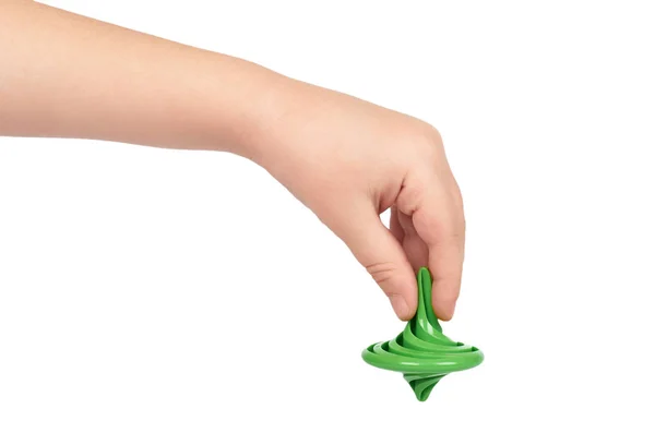 Giroscópio de brinquedo verde com mão de criança, isolado no fundo branco — Fotografia de Stock