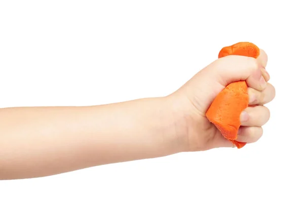Barra de plasticina laranja com mão de criança, isolada em fundo branco — Fotografia de Stock