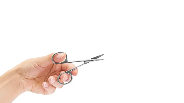 Manicure scissors in hand isolated on white background. copy space, template — Stock Photo, Image